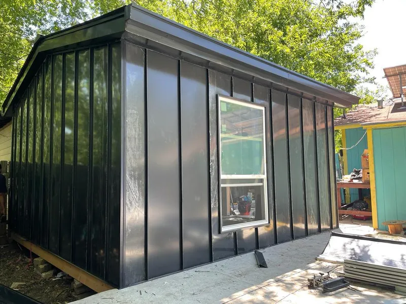 Black standing seam metal wall panels for Roof Inspection in Braddock